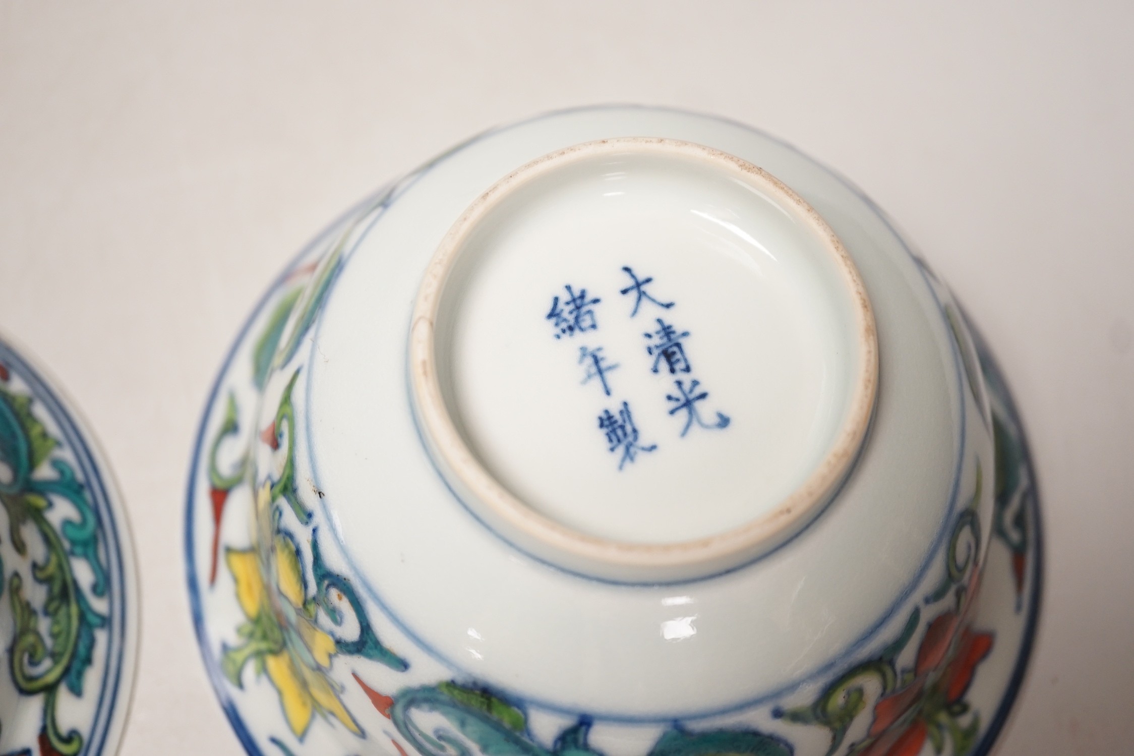 A near pair of Chinese doucai bowls. Tallest 7cm